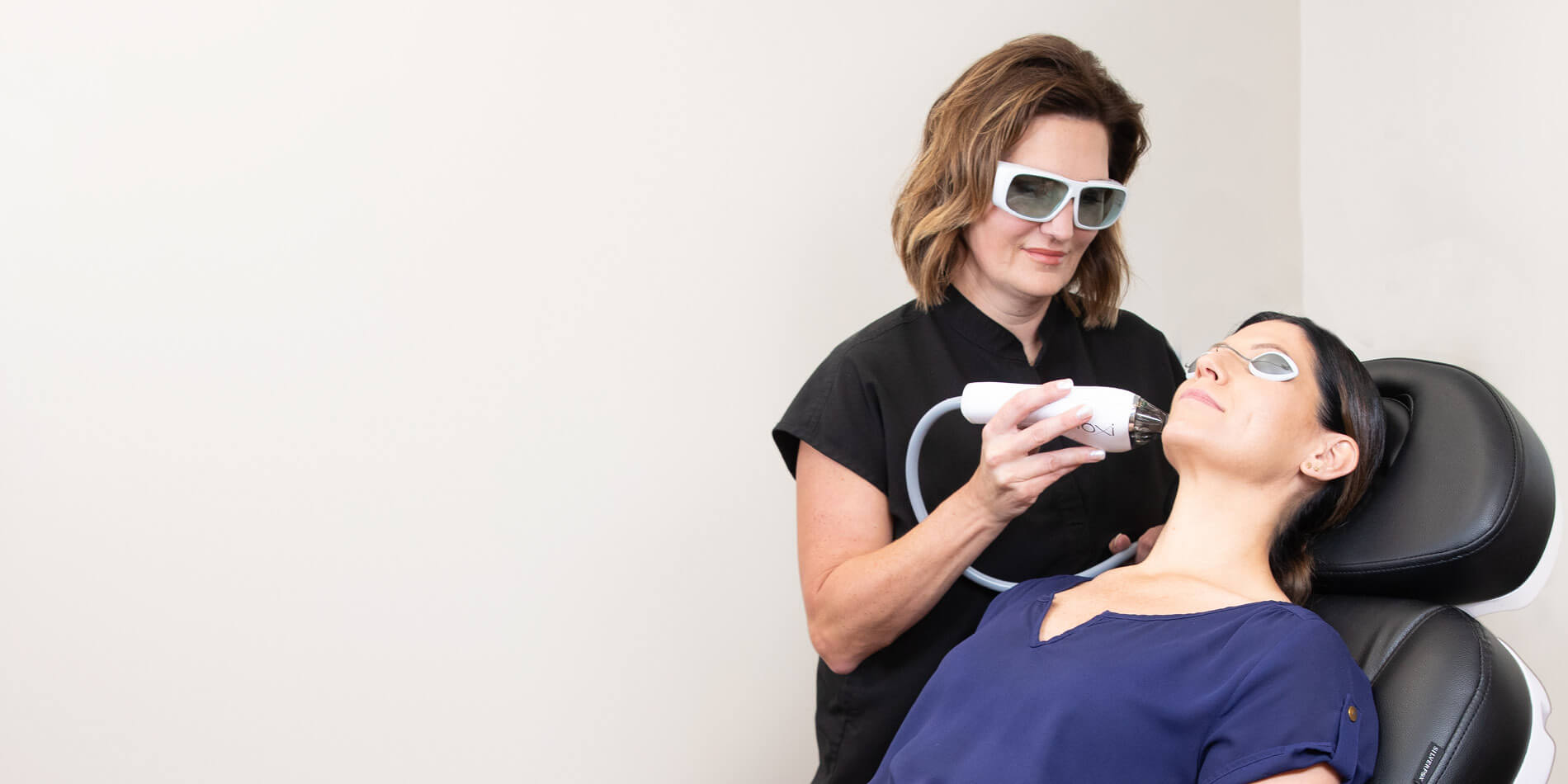 woman receiving laser treatment