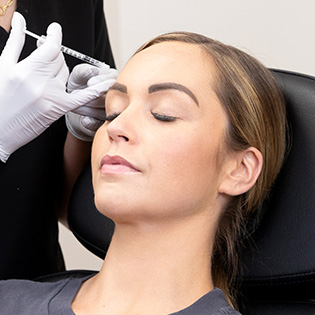 woman receiving Botox treatment in forehead