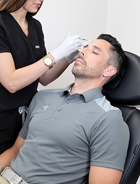 man receiving Botox treatment